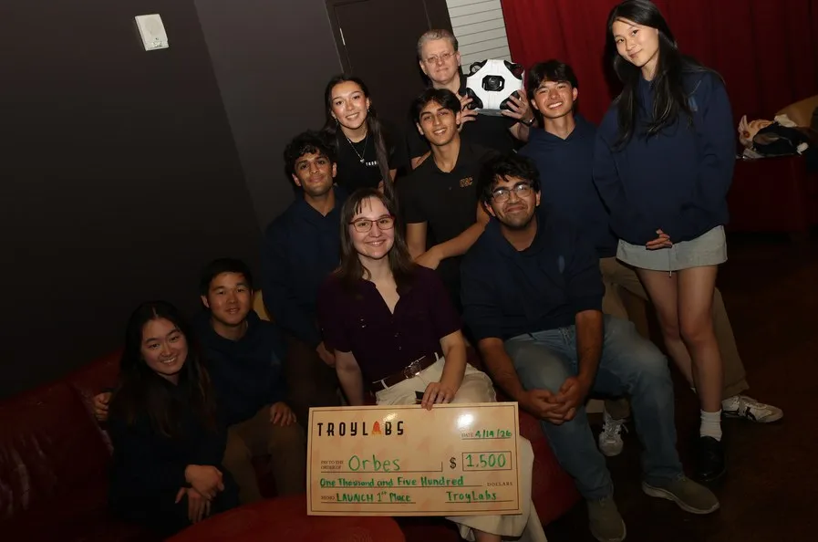 Team with an oversized check